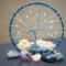 blue and white swirls give this tree the look of refreshing peppermint. It is adorned with glass crystal beads